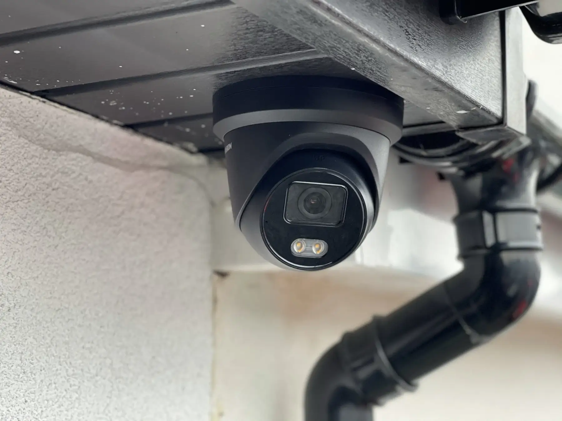 Dome CCTV camera fitted under the eaves of an Essex property