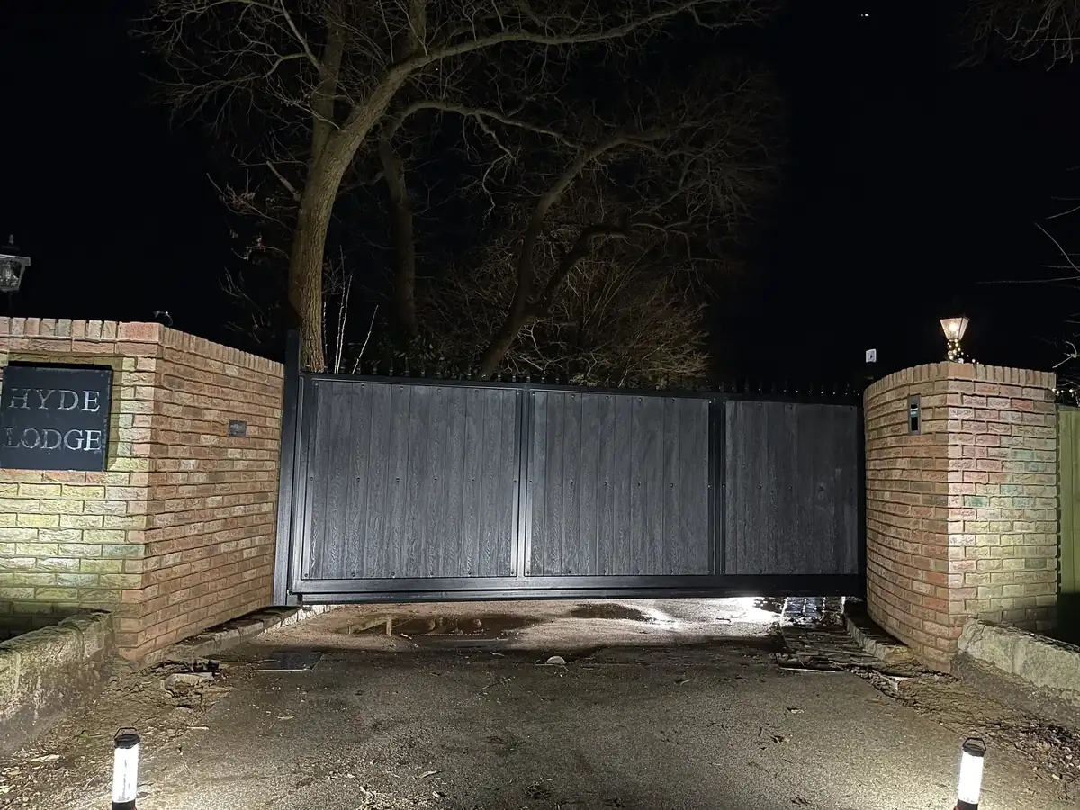 New driveway gate on a mature property